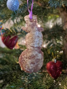 Pork crackling Christmas snowman decoration on a Christmas tree